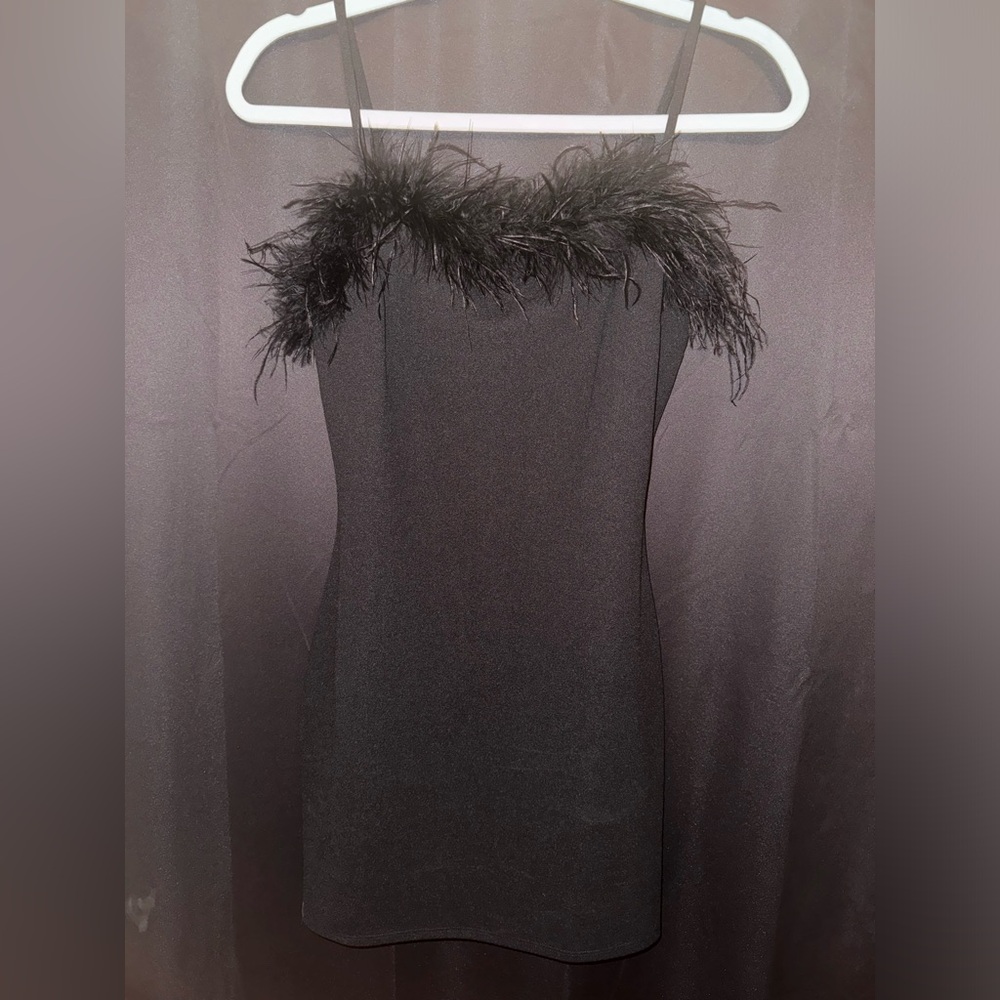 Black body-con dress. Size S. NEVER WORN